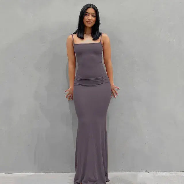 Soft and stretchy blush sleeveless maxi dress with a fitted silhouette. Purple.
